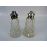 Two hallmarked silver topped salt shakers