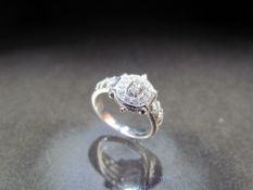 18CT white gold diamond halo style dress ring of approx 60pts