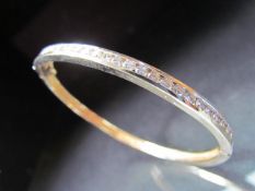 14K bangle set with 24 diamonds approx .05ct. Weight approx 18.8g.