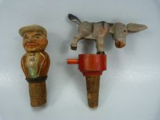 Articulated donkey bottle stopper (Bucks) along with a carved wooden figure of a man.