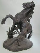 Resin figure of rearing horse and man