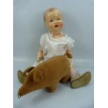British Made 'Bakelite' doll and a Victorian toy in the form of a pig