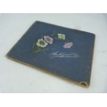 Autograph album containing hand drawn pictures