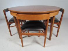 Hans Olsen for Frem Rojle Mid Century teak table and four chairs upholstered with black