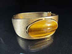 Contemporary 9ct Gold Satin finished bangle approx 24.6mm narrowing to 12.3mm at the back. Set