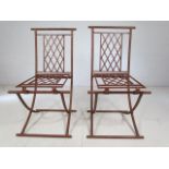 Two wrought iron chairs (folding)