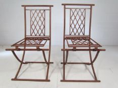 Two wrought iron chairs (folding)