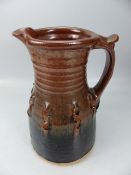 Studio Pottery - Copper lustre glaze jug with pinched detailing to middle. No makers mark