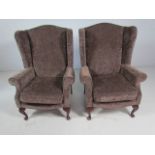 Velvet upholstered antique style wing back armchair