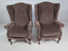 Velvet upholstered antique style wing back armchair