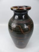 Studio Pottery vase decorated in dark colours with features