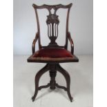 Unusual Rosewood Art Nouveau ladies swivel desk chair with open fretwork back and upholstered