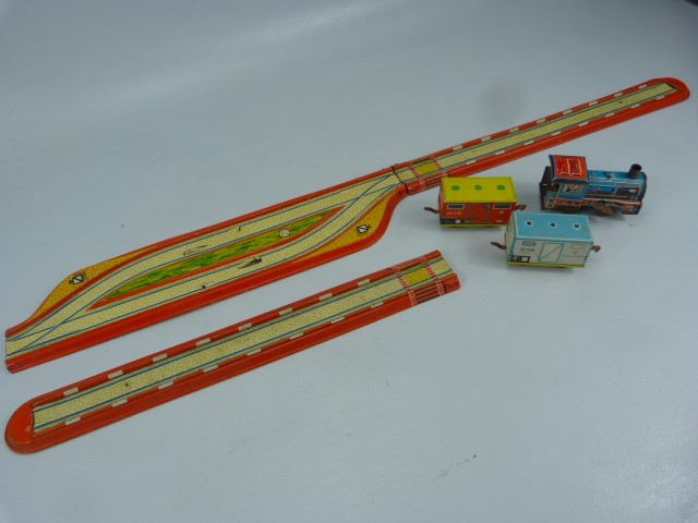 German vintage tinplate clockwork train, carriages and track.