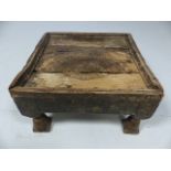 Low antique stool with hammered decoration