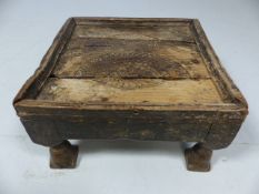 Low antique stool with hammered decoration