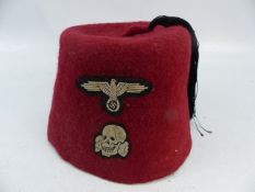 WW2 German S.S. Volunteers red dress fez uniform cap. Centre black tassels present. Bevo woven eagle