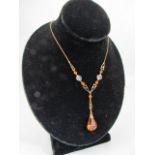 Vintage necklace signed by W. Bs. Amber coloured pendant on ornate gold coloured chain.