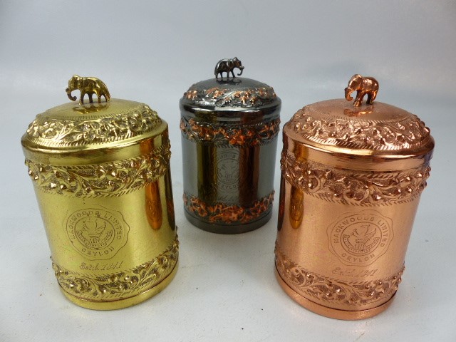 Three metal ware pots to with elephant finials. 'Ceylon Mackwood Limited'