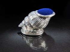 Large silver pin cushion in the form of a conch shell. Approx weight 26.5g
