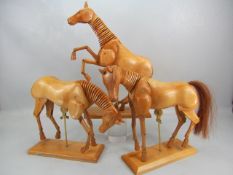 Three model artists horses