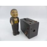 Antique carved wooden man in the form of a brush holder and a vintage camera ' No2 Cartridge Hawk-