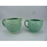 Arthur Woods Mid century pair of graduating turquoise glazed jugs