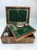 Rosewood Antique dressing campaign box lined with Green Velvet. Fitted with silver plated topped