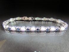 Silver Line bracelet set with Opals and Sapphire panels