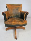 Antique Green leather captains chair on swivel base