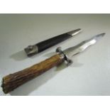Militaria: A Victorian Scottish Dirk Dagger with rare wavy blade and antler handle, with leather and
