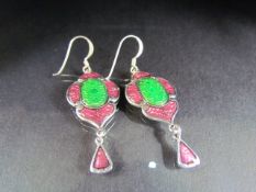 Silver pair of enamel set earrings, in the abstract design.