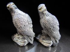 Silverplated pair of condiments in the form of eagles.