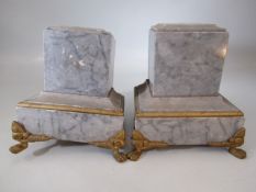 Pair of marble plinths with gilt feet