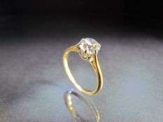 Ladies Solitaire Diamond ring. 18ct hallmarked yellow gold ring with Platinum setting and a fine,