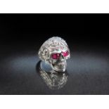 Unusual silver Skull ring set with ruby coloured eyes