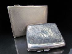Hallmarked silver Birmingham cigarette case F. D Long 1923. Along with a silverplated example Approx