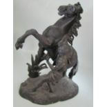 Resin figure of rearing horse and man