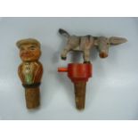 Articulated donkey bottle stopper (Bucks) along with a carved wooden figure of a man.