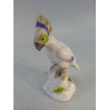 Meissen Miniature figure of a parrot with crossed sword marks to base.