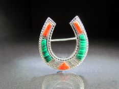 Malachite and Coral set brooch in the form of a horseshoe