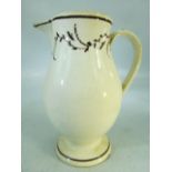 18th Century Staffordshire creamware jug of tall form. Brown banding to rim and foot. With simple