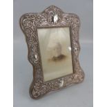 Hallmarked silver photo frame decorated with cartouche and flora