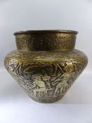Large brass Jardiniere with pierced work top and embossed decorative base.