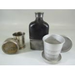 Pewter and leather bound flask along with an unusual brass stirrup cup and one other
