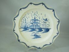 Pearlware Liverpool blue and white plate depicting pagoda scenes with swag edging