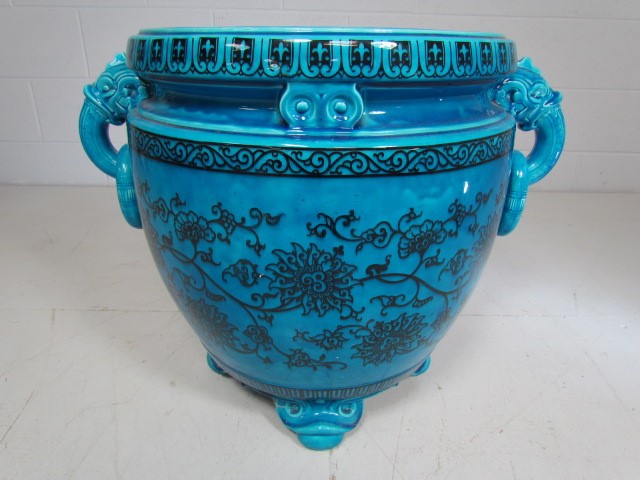 Oriental Blue large Jardiniere with Carp fish head handles holding loops. The outer bowl decorated