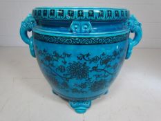 Oriental Blue large Jardiniere with Carp fish head handles holding loops. The outer bowl decorated