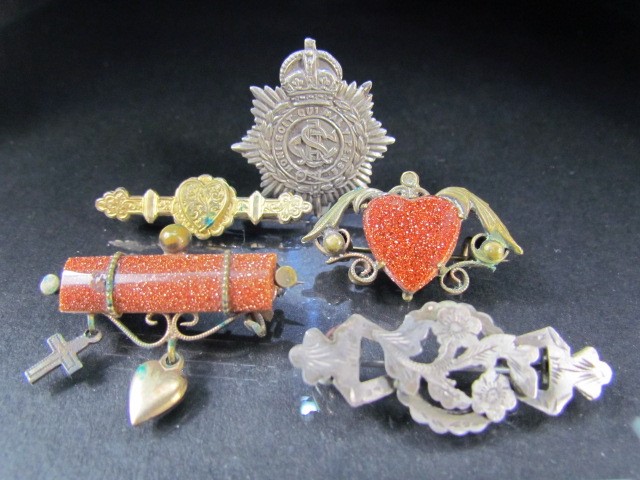 Behalf of the RNLI - Selection of sweetheart brooches to include some set with Goldstone. (5)