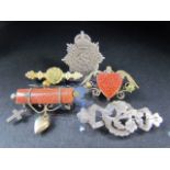Behalf of the RNLI - Selection of sweetheart brooches to include some set with Goldstone. (5)