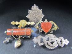 Behalf of the RNLI - Selection of sweetheart brooches to include some set with Goldstone. (5)